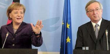 Angela Merkel, junto a Jean-Claude Juncker, presidente del Eurogrupo. | Archivo
